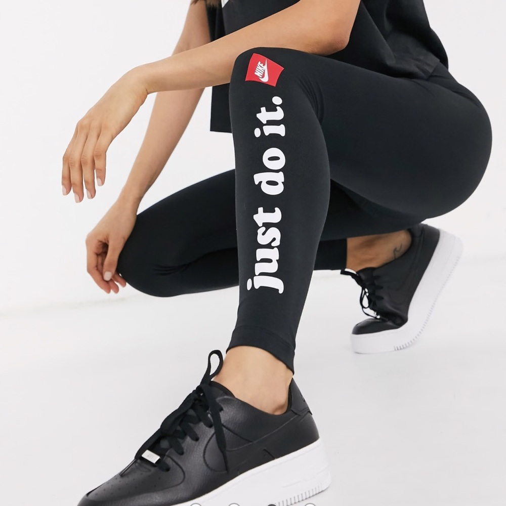 TWO PAIRS of Nike leggings.